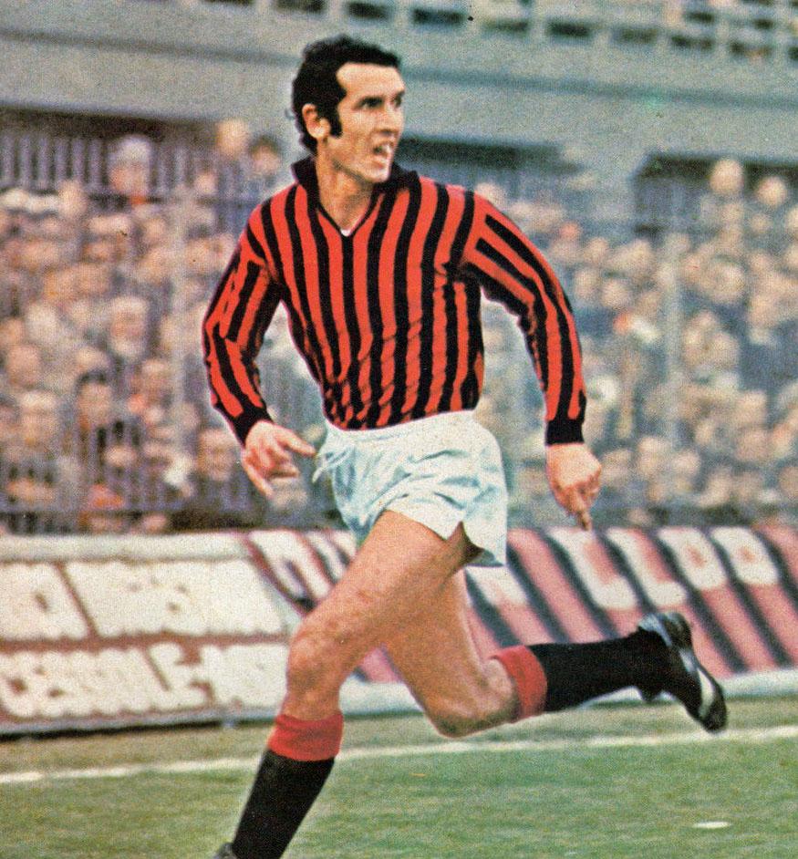Alberto Bigon in full flight before a packed San Siro (Forza Milan! cover photo, 1974-75 season). By 1979-80 the armband was his: it fell to Bigon to captain a side that finished third on the pitch and was then sent down to Serie B by the Totonero verdict — the first relegation in the club's history.