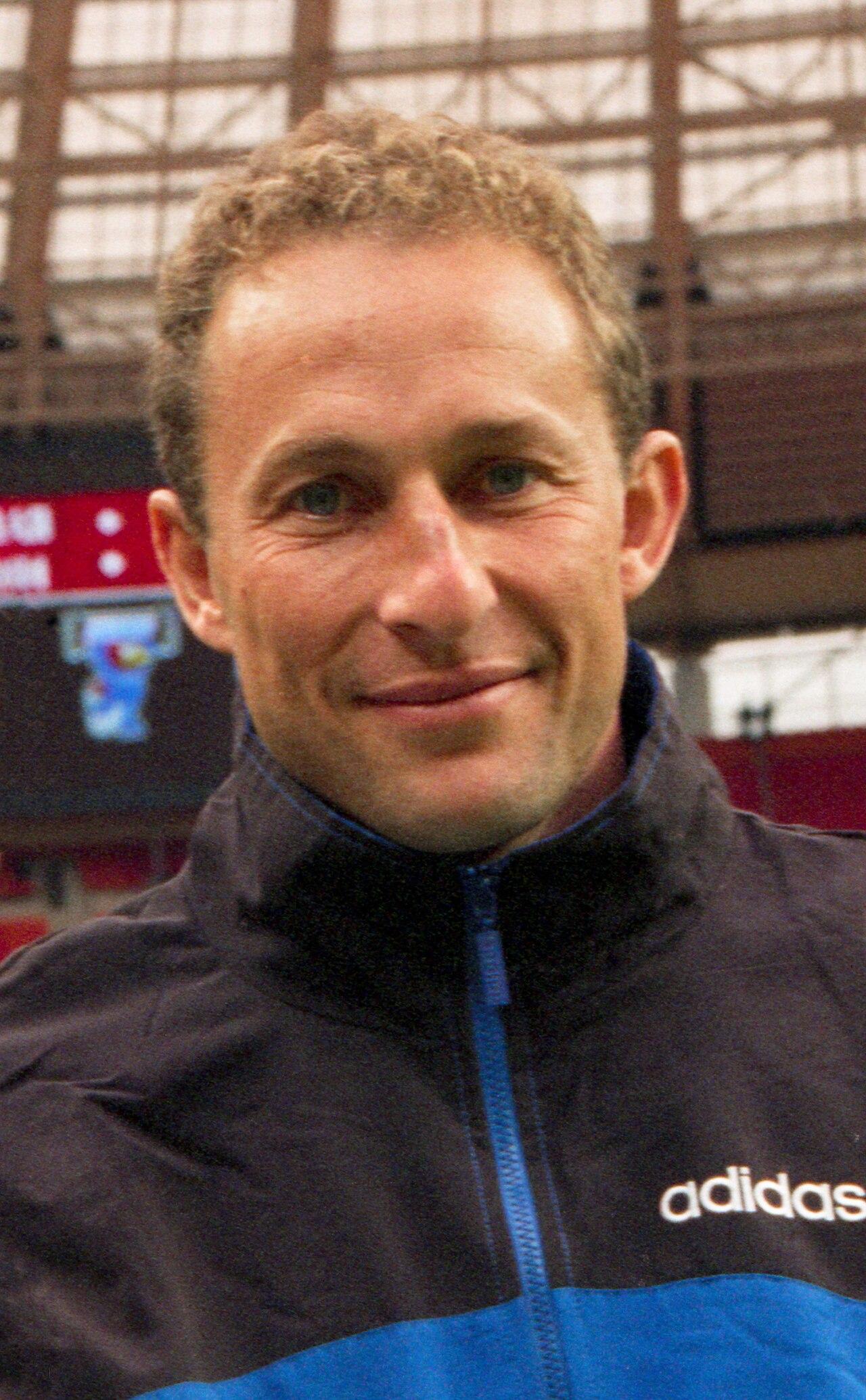 Jean-Pierre Papin, the reigning Ballon d'Or who arrived from Marseille in 1992 — 13 league goals in the 1992-93 title season, then a substitute's view of Munich as his old club took the cup from his new one (photographed at the Luzhniki Stadium, 1997).