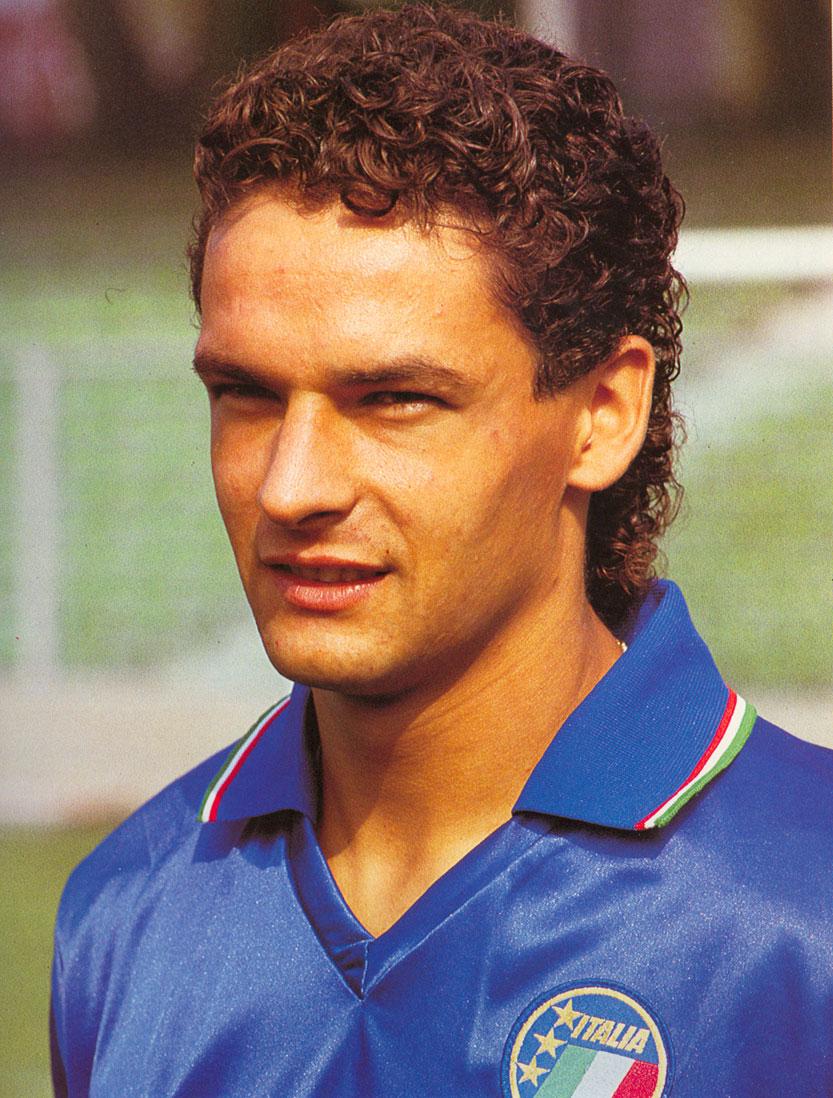 Roberto Baggio in the azzurro of Italia '90, the Divine Ponytail still a promise. By 1995 he was Milan's: prised from Juventus by Berlusconi, he won the 1995-96 scudetto in his first rossonero season — back-to-back league titles with two different clubs — before enduring the coachless drift of 1996-97 under Tabárez and the returning Sacchi, when everything Capello built came apart at once.