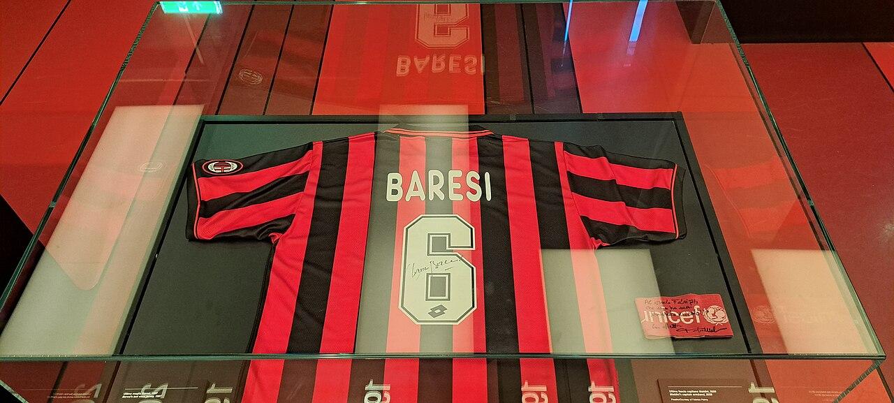 The last number 6 — Franco Baresi's final match-worn, signed Milan shirt from 1996-97, framed under glass at the Mondo Milan Museum. When the capitano retired at the end of that season, after 20 years and 719 appearances, the club retired the number with him.