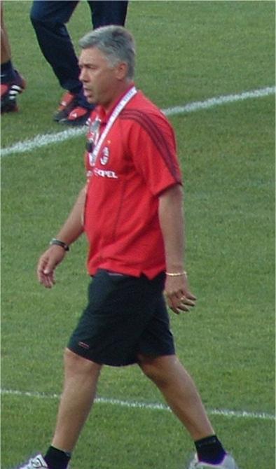 Carlo Ancelotti on the training pitch in Milan's red Adidas kit bearing the Opel sponsor — the coach who took over from Fatih Terim in November 2001 and dragged the Rossoneri back into the Champions League.