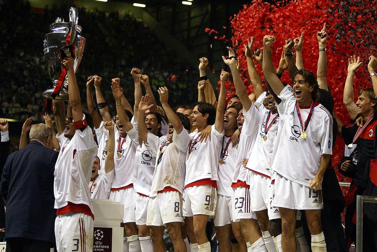 Old Trafford, 28 May 2003: captain Paolo Maldini (No. 3) raises the European Cup after Milan beat Juventus 3-2 on penalties in the first all-Italian final — forty years after his father Cesare lifted the same trophy at Wembley.