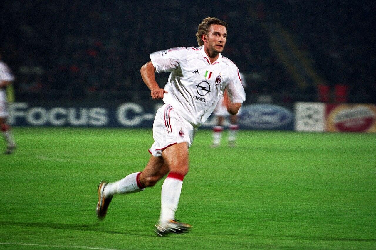 Andriy Shevchenko in the white away shirt, 14 September 2004 — the tricolore scudetto badge on his chest earned by the title Ancelotti's Milan had won four months earlier.