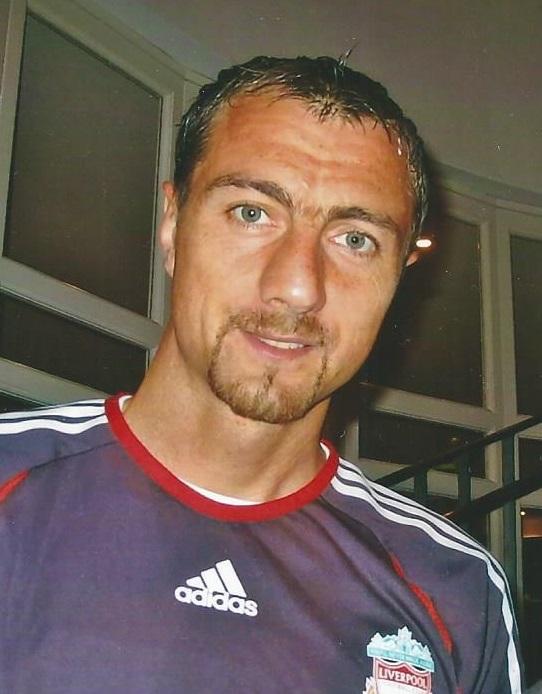 Jerzy Dudek in Liverpool colours, 2006. The Polish goalkeeper's wobbling-legs routine on the goal line and his double save from Shevchenko in extra time turned Istanbul from a Milan procession into the defeat that defined a generation of rossoneri — a wound only answered two years later in Athens.