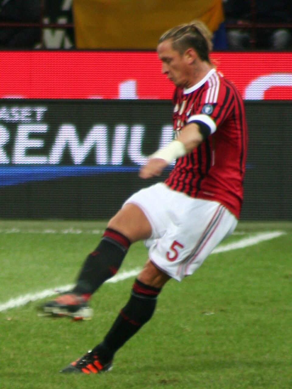 Philippe Mexes crosses during Milan v Siena at San Siro, 17 December 2011 — the free-transfer signing from Roma who arrived in the summer 2011 rebuild.