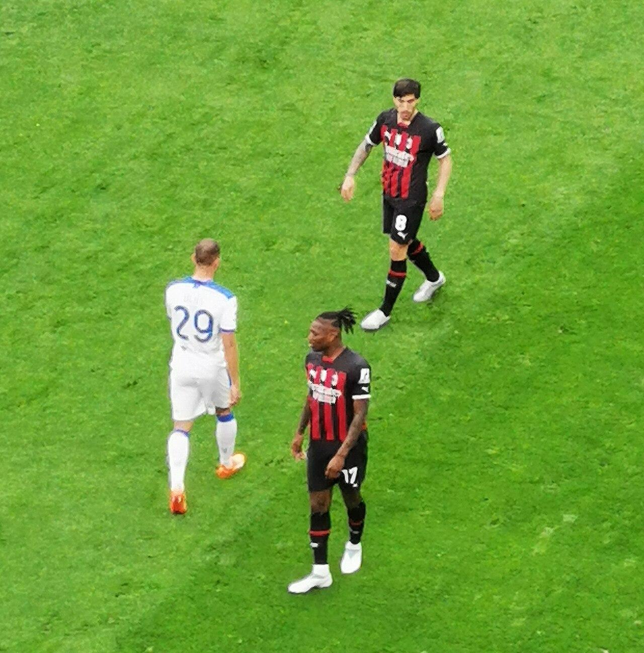 Sandro Tonali and Rafael Leão at the Stadio Giuseppe Meazza on 23 April 2023, during Milan-Lecce. Within six weeks Leão had signed to 2028 with a €175m release clause; within three months Tonali, the Brescia boy who had grown up a Milan supporter, was sold to Newcastle United. The same photograph holds the man Milan kept and the man Milan sold.
