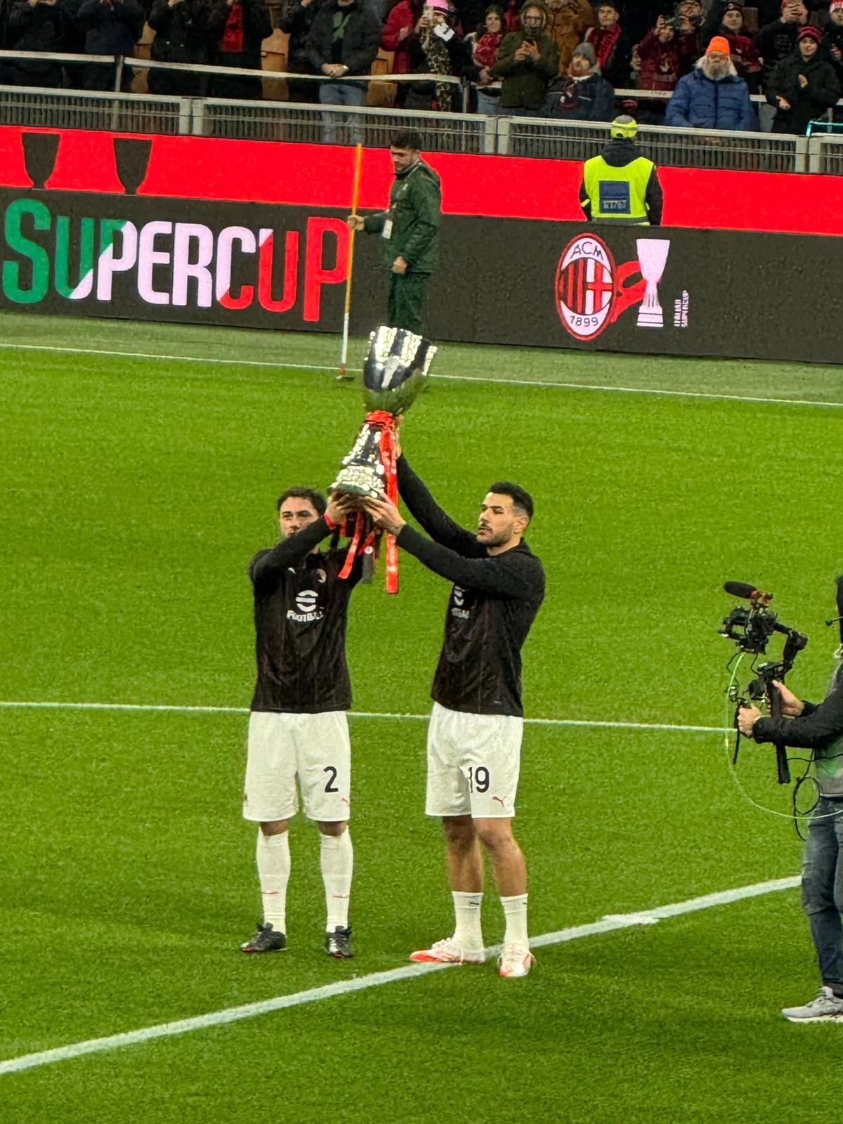 Davide Calabria (2) and Théo Hernández (19) lift the Supercoppa Italiana to the Curva before Milan v Cagliari at San Siro, 11 January 2025 — five days after Sérgio Conceição's side came back from 2-0 down to beat Inter 3-2 in Riyadh.