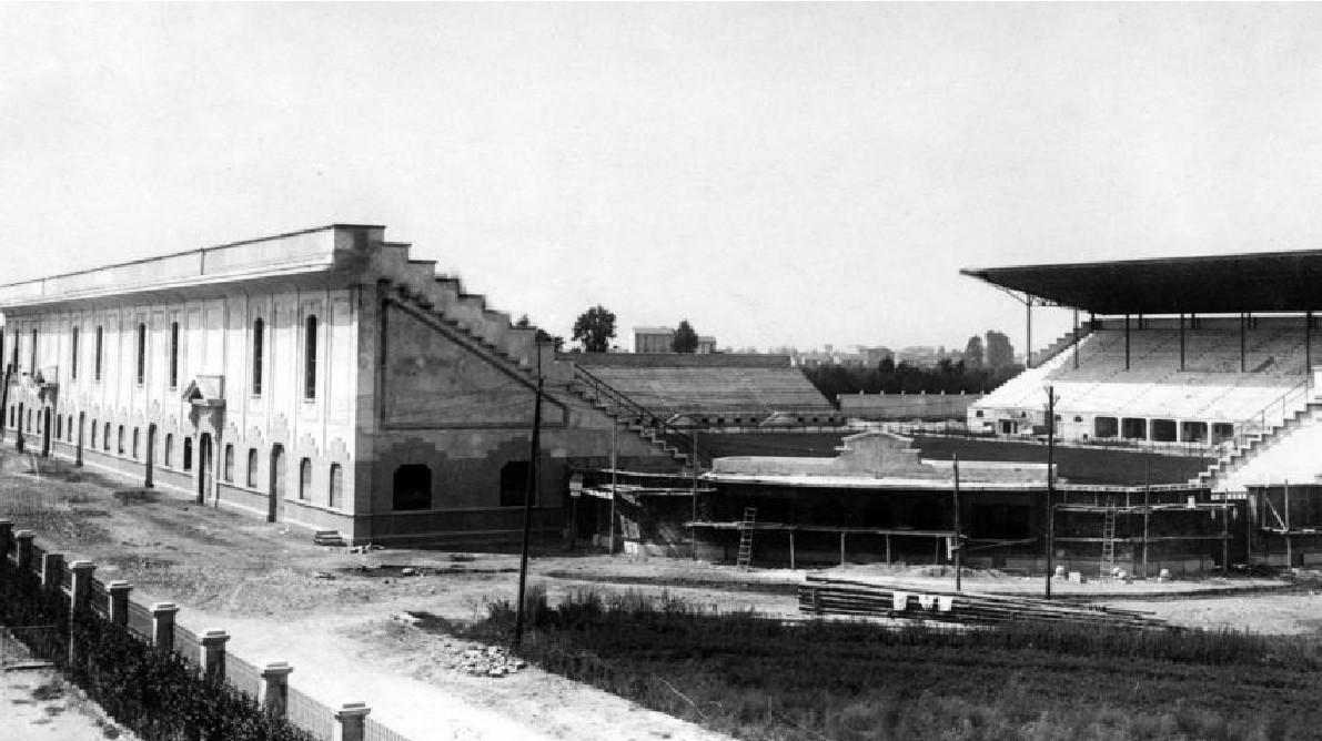San Siro rising from the fields west of Milan — the stadium Piero Pirelli commissioned and paid for, photographed during the build that began in 1925 and finished for the September 1926 opening.