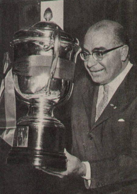 President Andrea Rizzoli cradles the Latin Cup, the continental prize Milan lifted in 1956 — silverware for the season the rossoneri also reached the semi-final of the first European Cup.