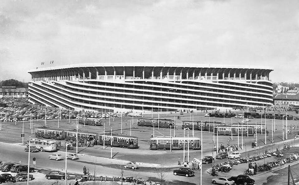 San Siro in the 1950s, after the 1954-55 second-tier expansion — a postcard view with the tram terminus in the square outside, the stage for the Golden Fifties.