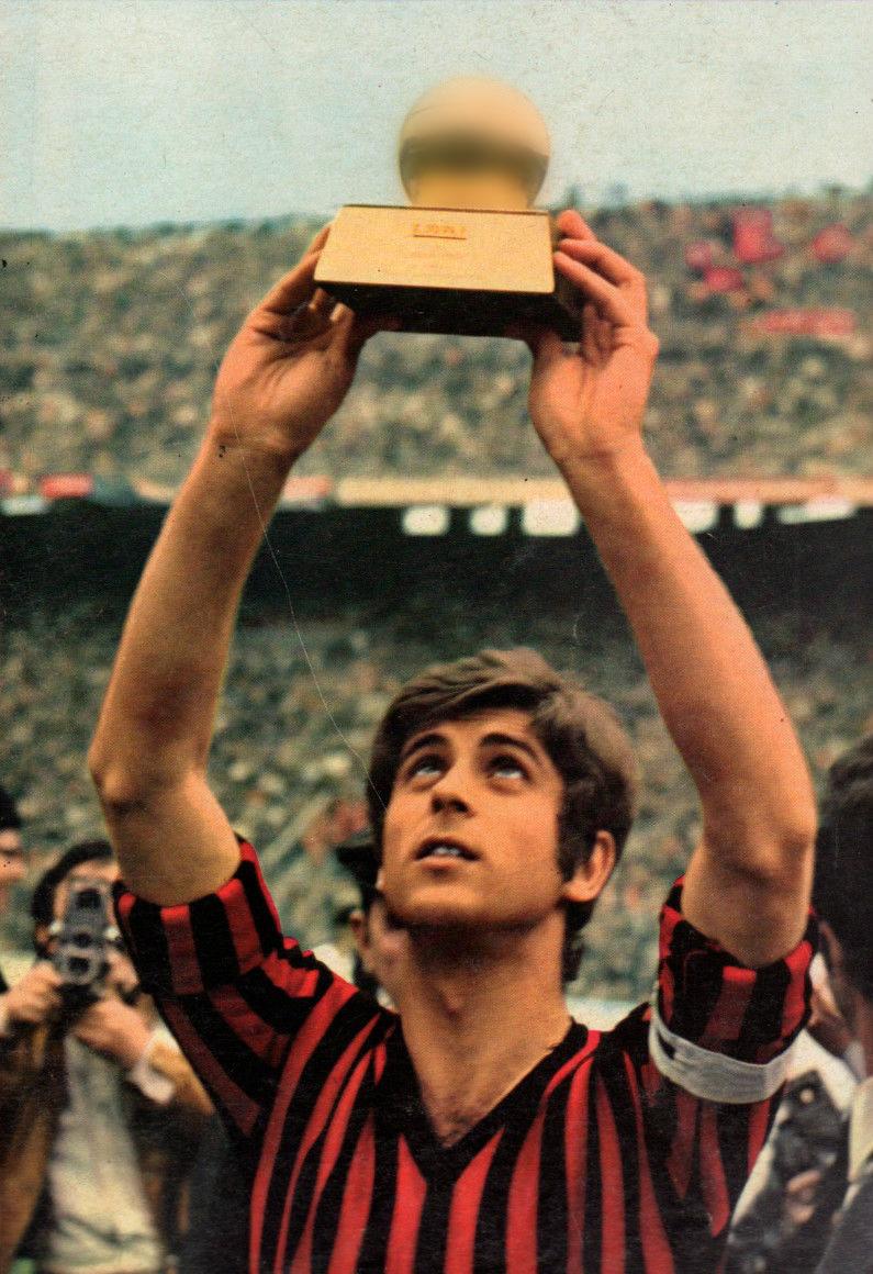 Captain Gianni Rivera lifts the 1969 Ballon d'Or before the San Siro crowd at its public presentation in April 1970 — the first Italian-born winner of the award.