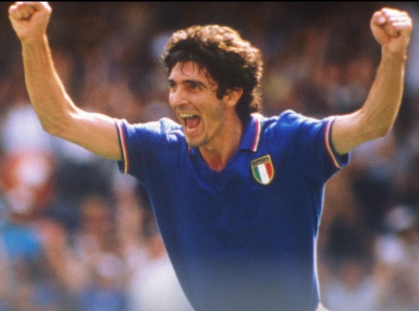Paolo Rossi celebrates at the 1982 World Cup in Spain — six goals, the Golden Boot, the Ballon d'Or. In the summer of 1985 the hero of the Mundial arrived at Milanello from Juventus: a fading star joining a Milan still finding its feet, but a name that made San Siro dream through the 1985-86 season.
