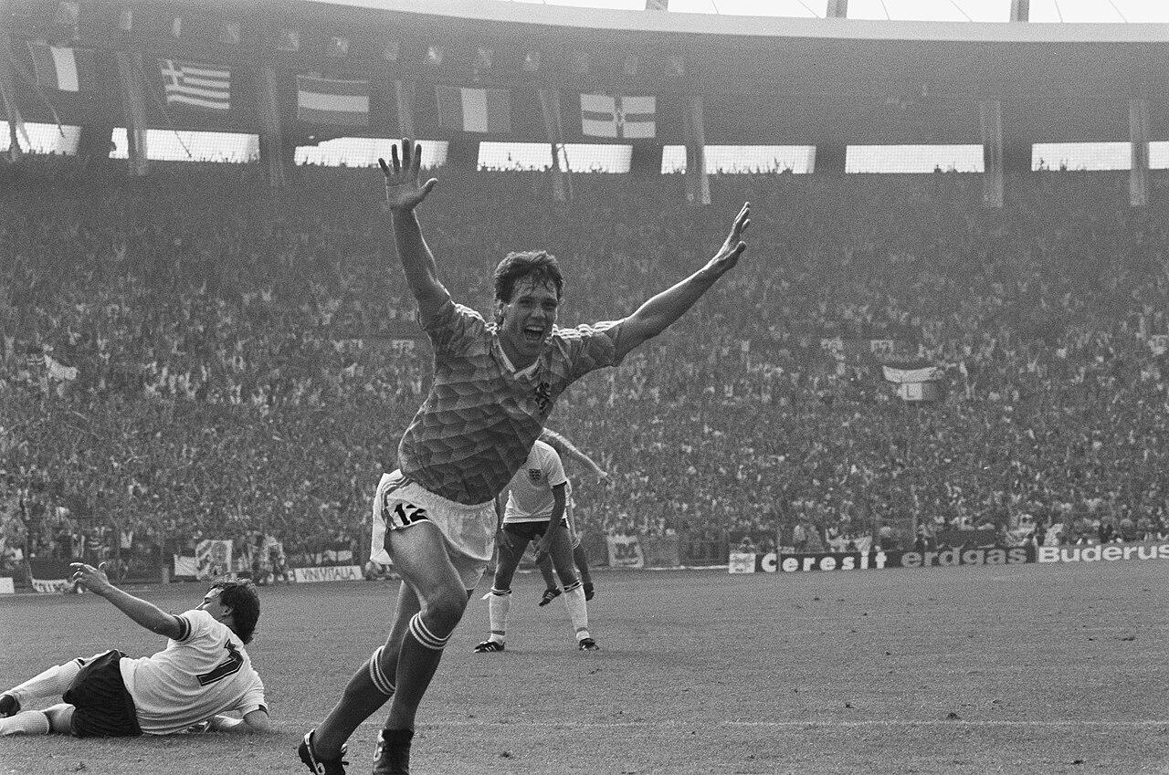 Marco van Basten wheels away after scoring against England at Euro 88 (England 1-3 Netherlands, Düsseldorf, 15 June 1988) — a hat-trick night, weeks after lifting the scudetto in his injury-wrecked first Milan season. That summer he became European champion and the deadliest striker alive.